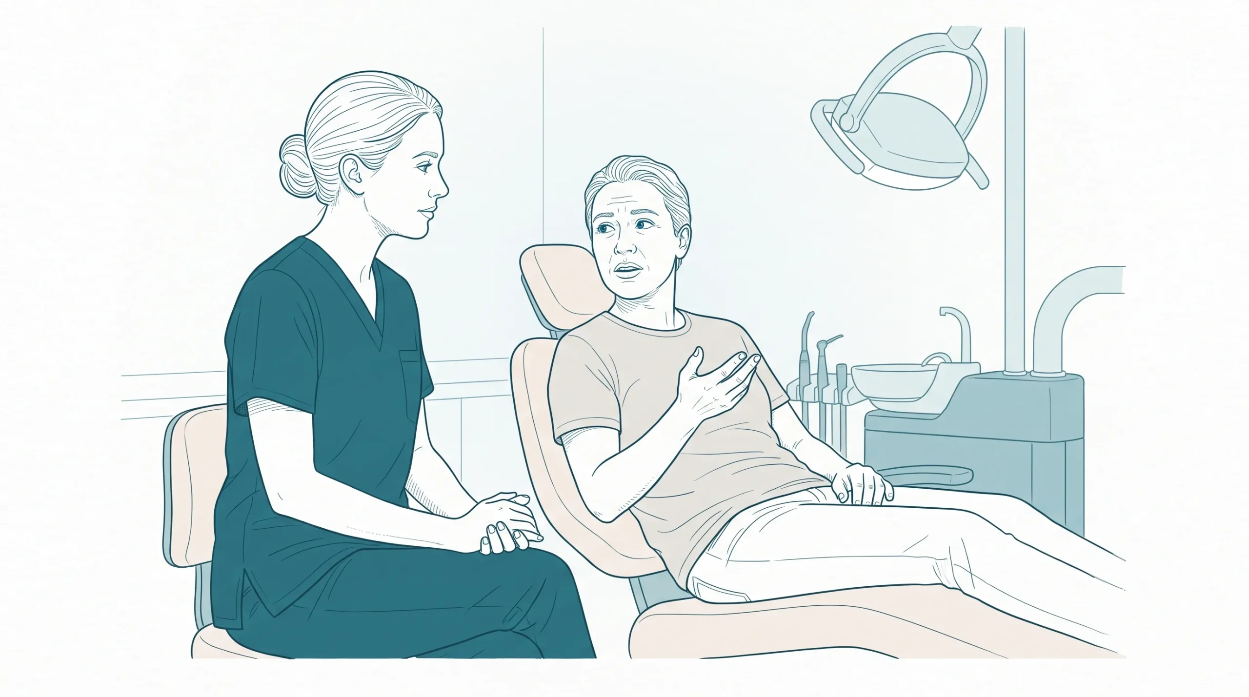 A dentist in clean clinical scrubs listens as an adult patient describes a concern in a dental surgery, with both faces fully visible.